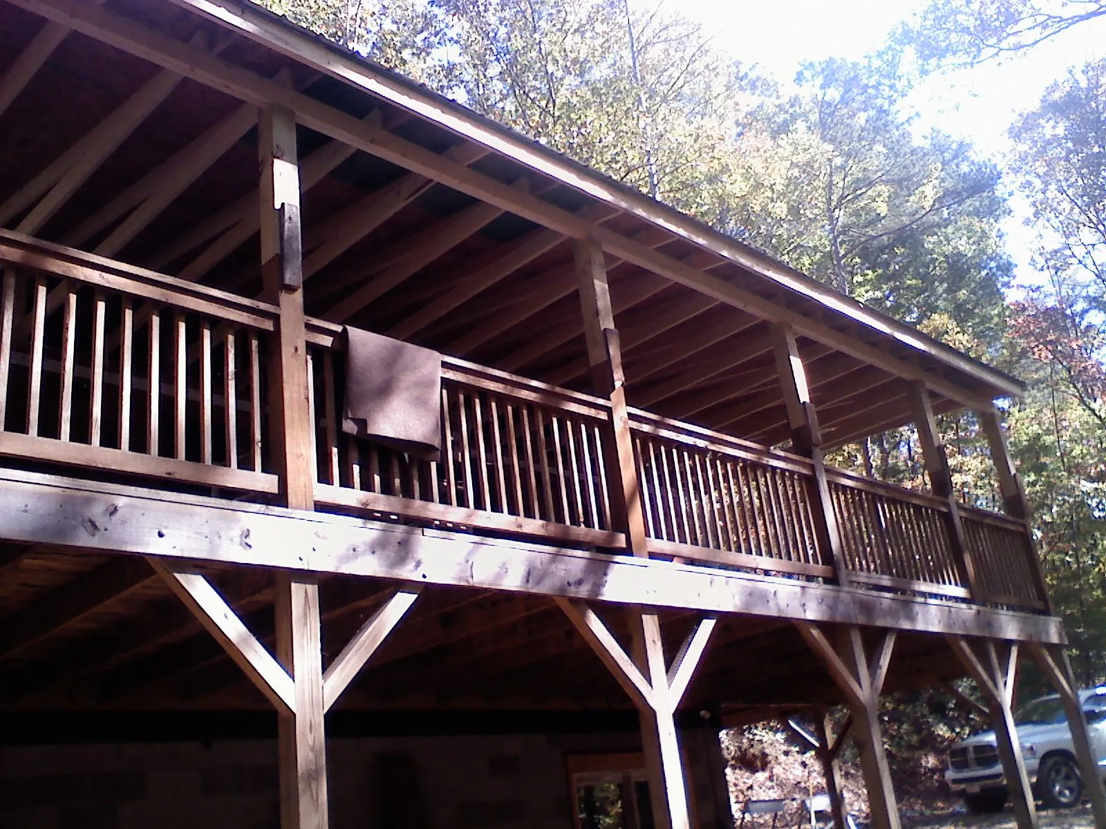 Timber framing under a new elevated porch and deck — Roof Leak Repair in Havana by Roofing Brothers